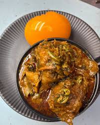Banga soup, swallow with chicken 